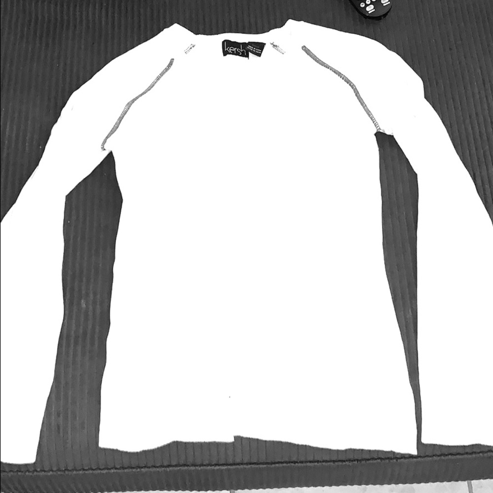 White sweater with gray piping around shoulders